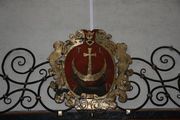 Szeliga skojarzona z godłem franciszkańskim Szeliga skojarzona z godłem franciszkańskim